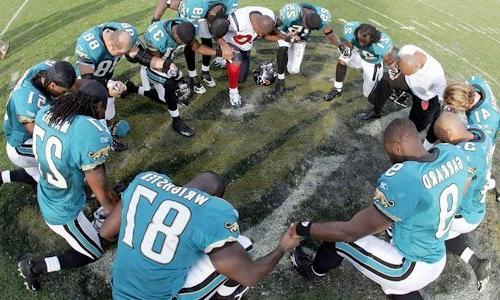 Anthony Johnson praying with the Jaguars